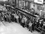 [Photo of TRIUMF Staff pictured with the ISAC Radio Frequency Quadrupole.]